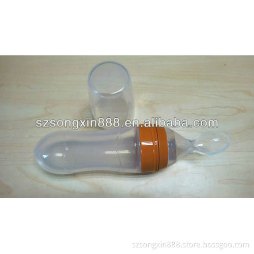 Cereal feeding by silicone baby bottle with spoon
